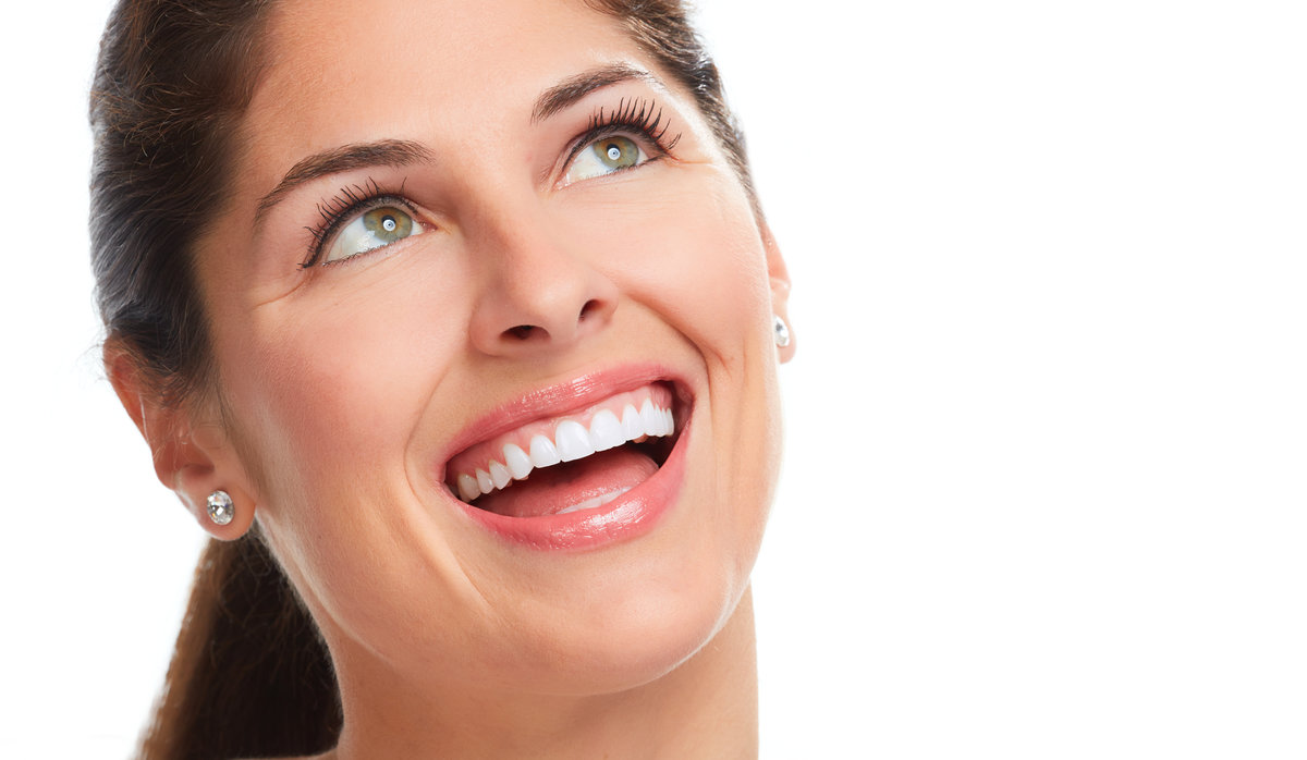 Happy young woman face with healthy white teeth. Dental health