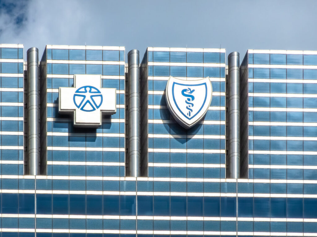 Chicago, Illinois, USA. Sep 18, 2025. The prominent Blue Cross Blue Shield logos adorn a modern glass building, symbolizing healthcare and insurance services.
