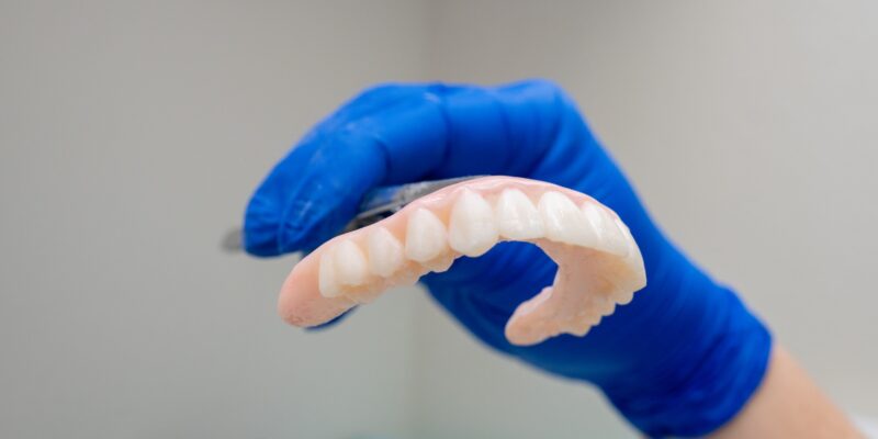 Secure Smile All-on-4 implant denture patient smiling